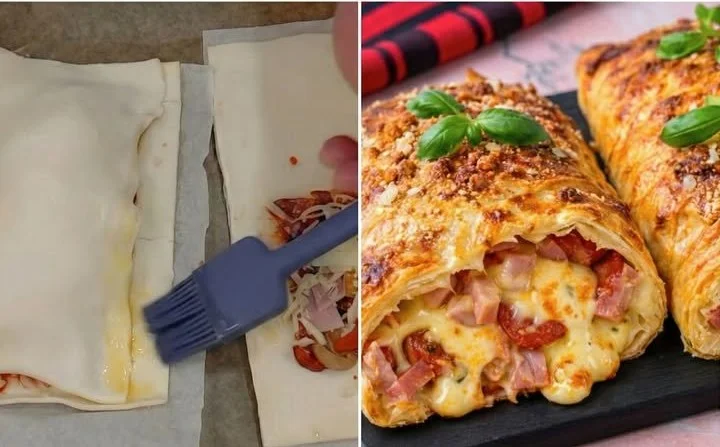Blätterteig-Calzone gefüllt mit Salami und Käse auf einem Holzbrett